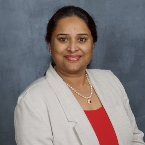 Editorial portrait of Reenu Cherian, founder of MicroTax. Real commissioned photograph, should be shot by a professional photographer, not AI-generated.